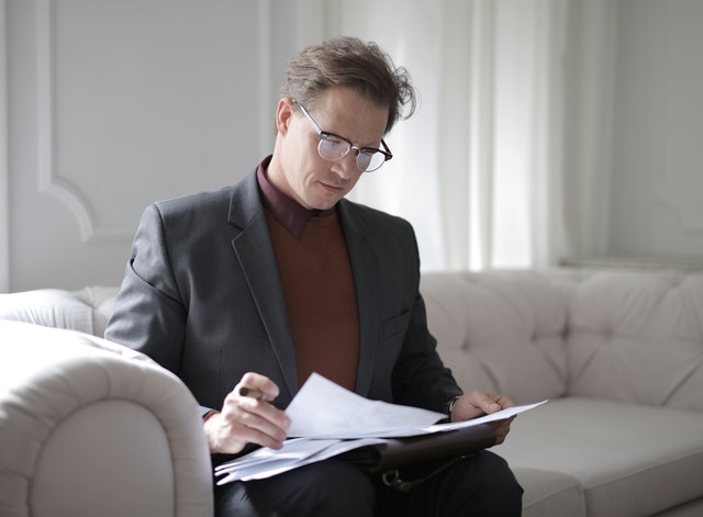 man reading over lease contract
