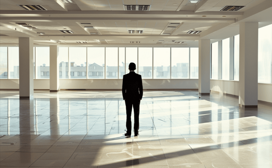 An asset manager looking at a empty floor of his commercial building space